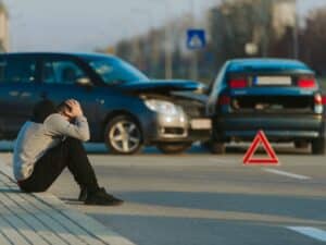 Sad man after car accident