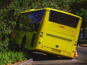 The bus flew off the road and crashed into a tree. Party bus accident concept