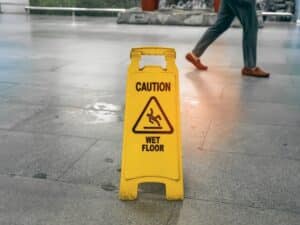 Caution wet floor sign. Concept of Elements of a Slip and Fall Claim in Las Vegas
